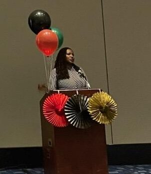 Grace-Ann Fasaye speaks during the GOLDEN Networking Reception